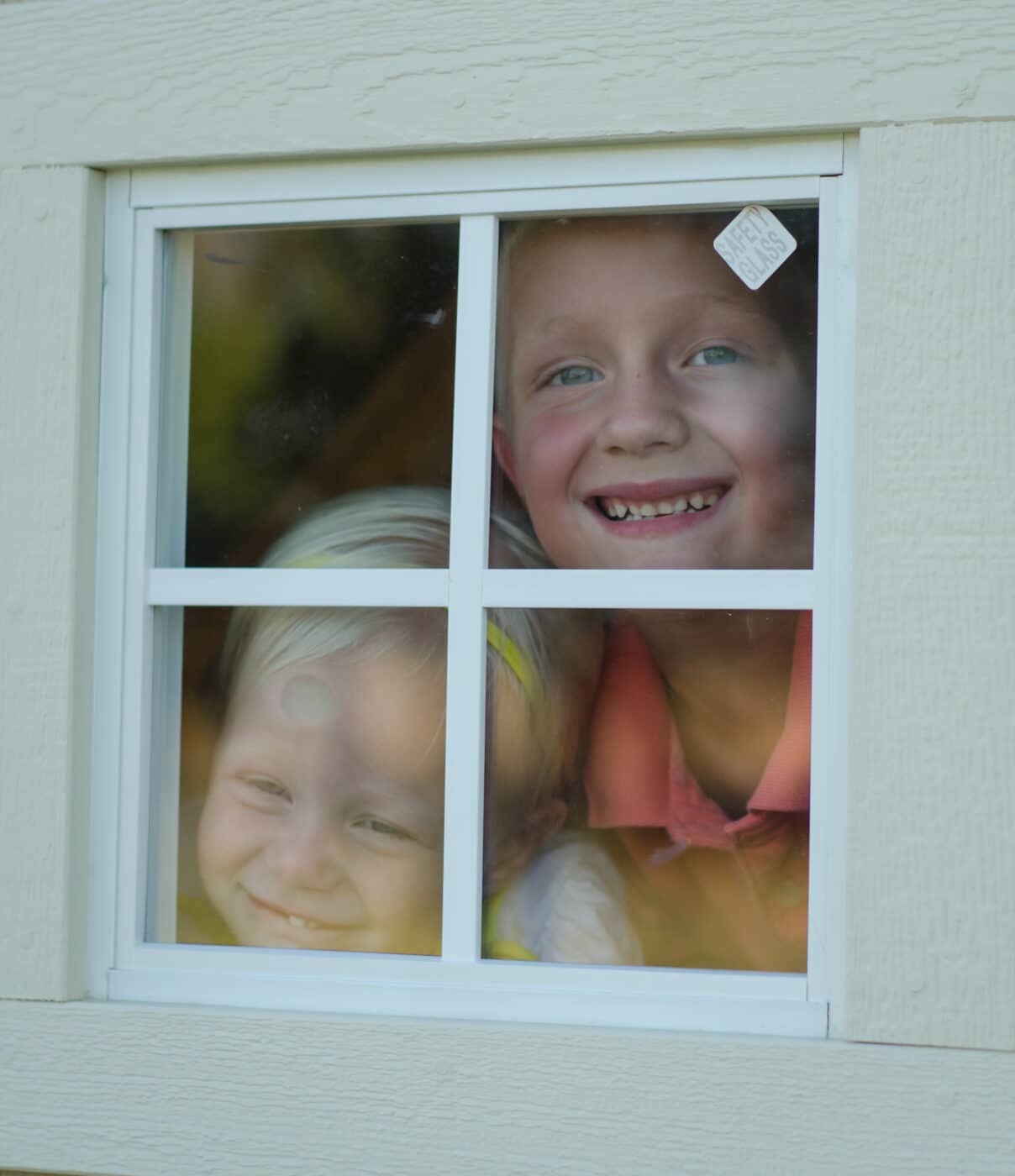 children looking from window of kids playhouses for sale