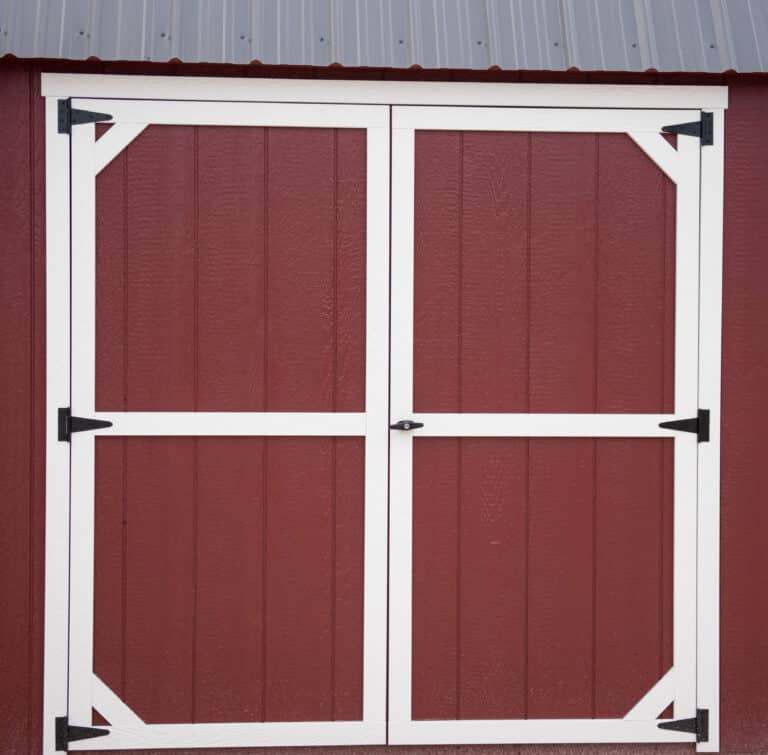 red wooden doors on shed in texas