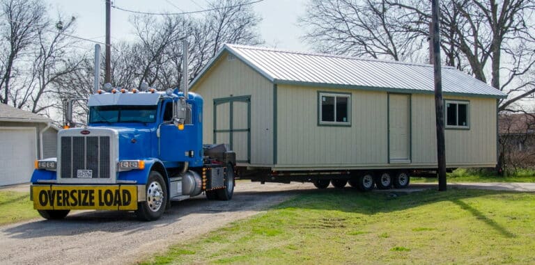shed hauler moving a portable storage building in texas